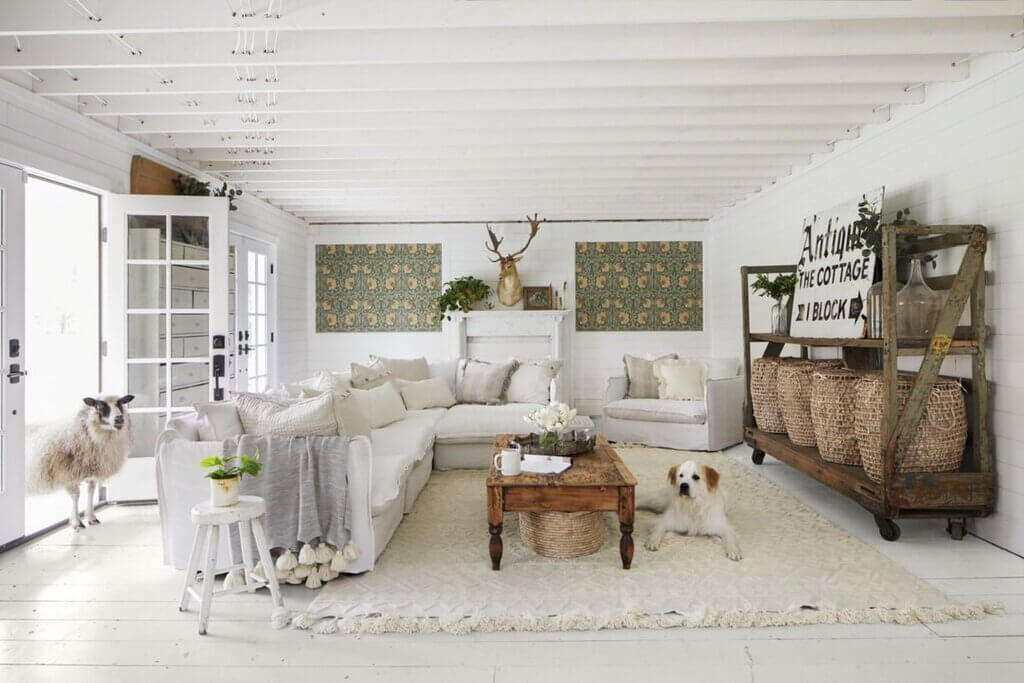 A living room filled with furniture and a white rug
