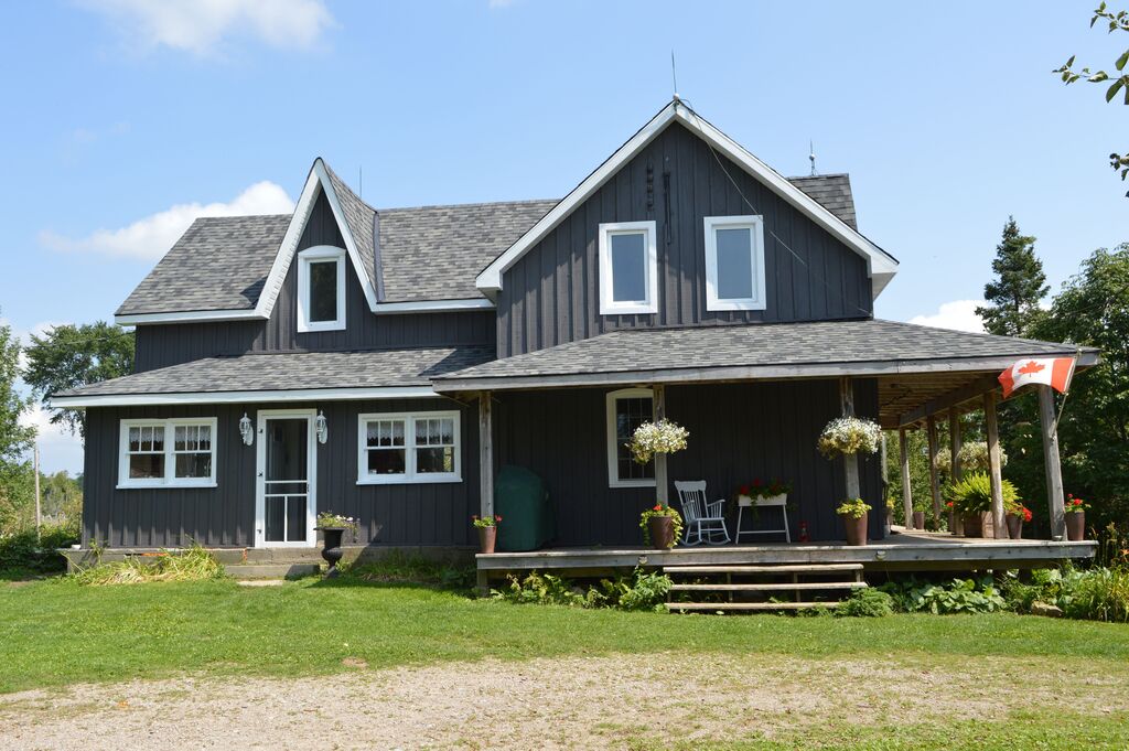 A house with a porch and a covered porch
