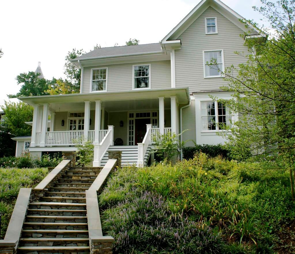 A white house with steps leading up to it
