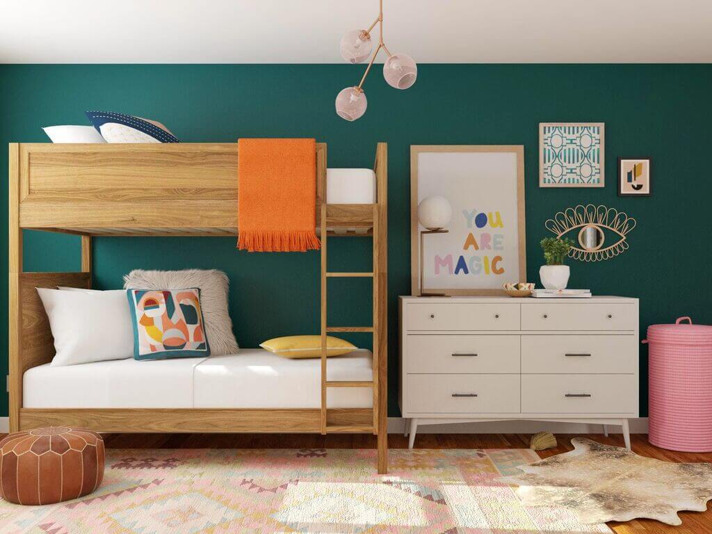 A bedroom with a bunk bed and a dresser
