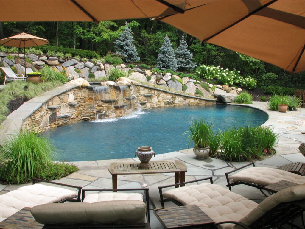 A Sloped Poolside sloped backyard ideas on a budget