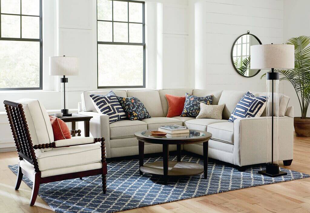 A living room filled with furniture and a large window
