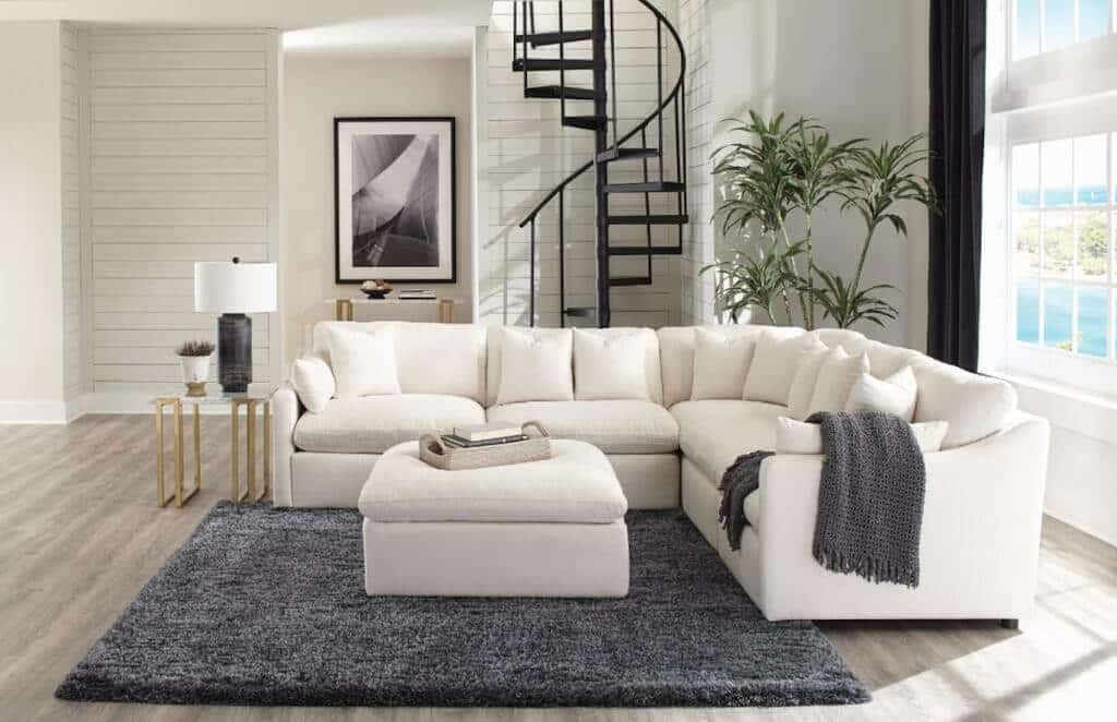 A living room with a large white sectional sofa
