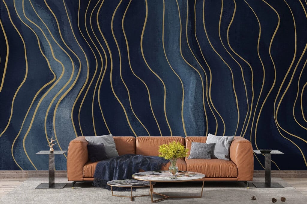 A living room with a white couch and a blue and gold wallpaper

