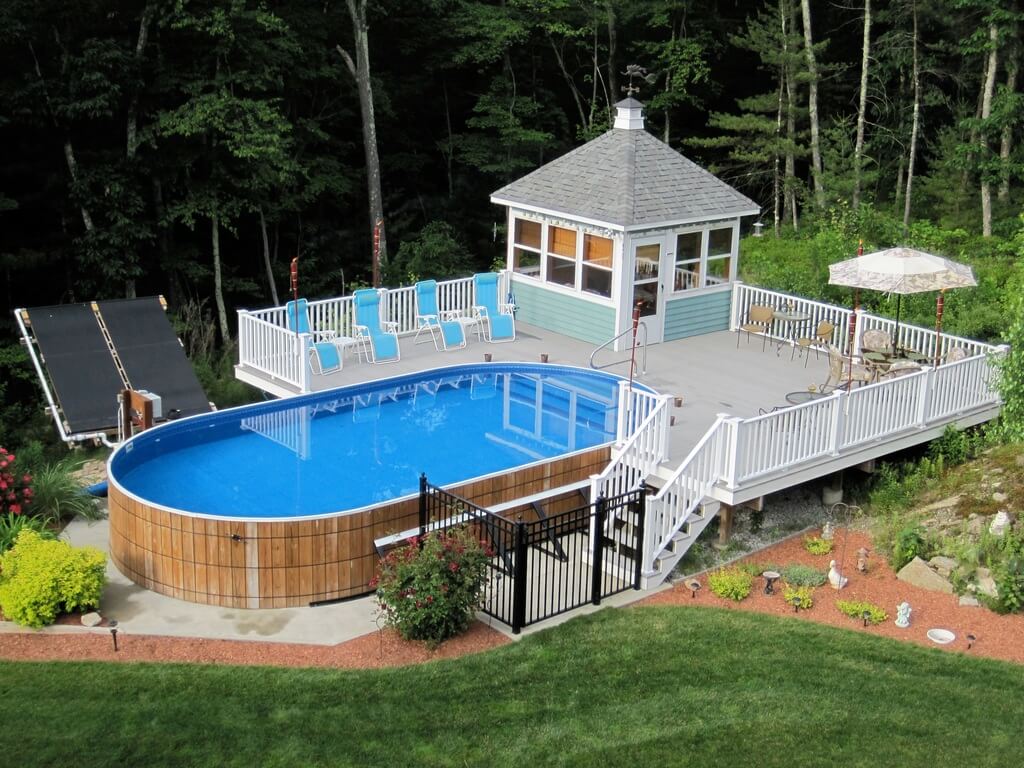 An above ground pool surrounded by a deck and a gazebo
