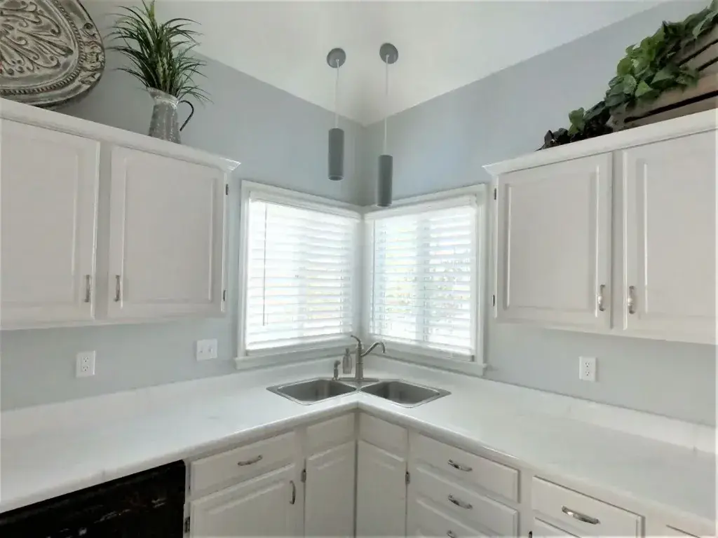 lighting over kitchen sink with window