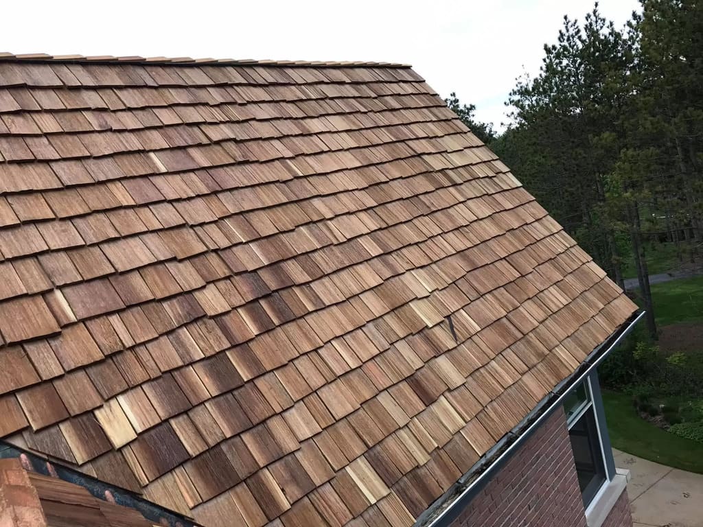 A Wooden Shingles with a brown shingled roof
