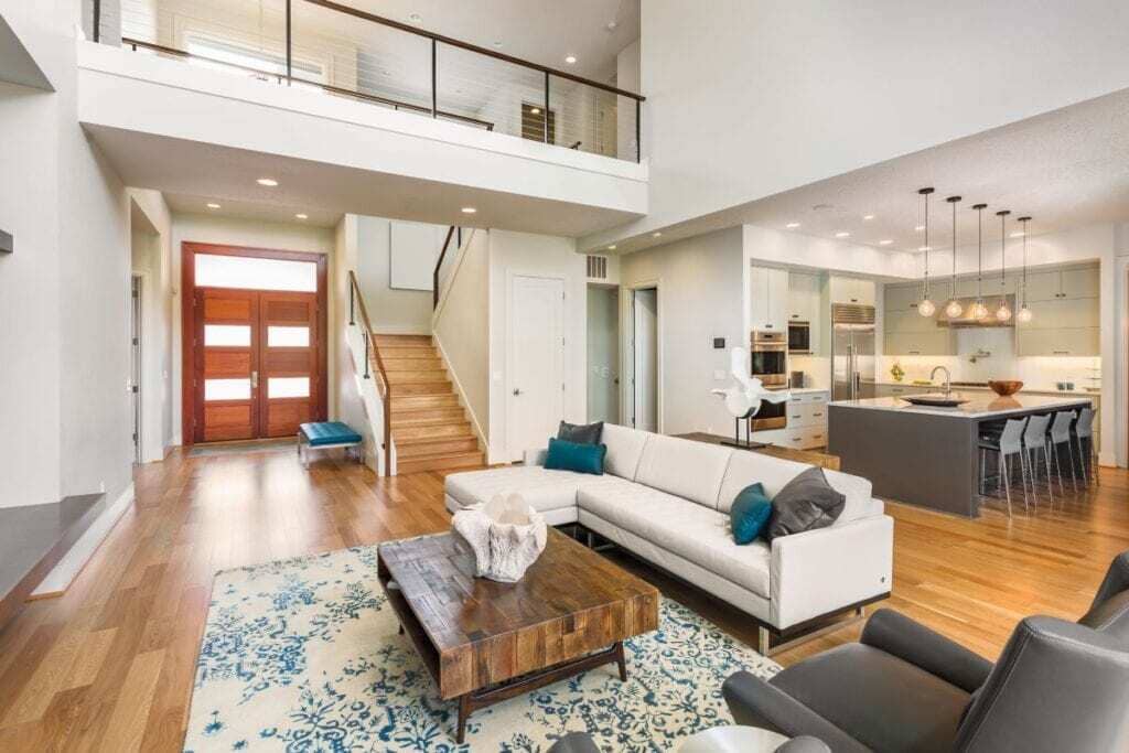 A living room filled with furniture and a staircase
