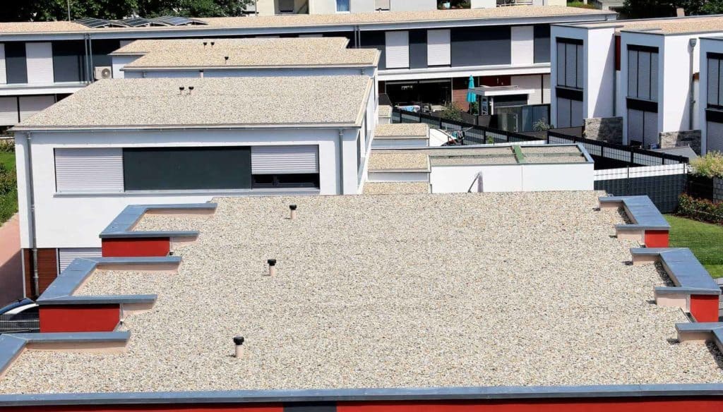 An aerial view of a building with a Flat roof
