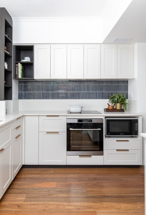 white kitchen cabinets with backsplash