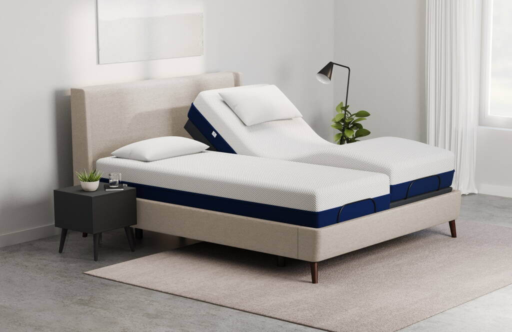 A Adjustable Bed Frame with a blue and white mattress on top of it
